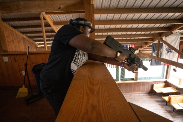 Person shooting laser tag gun