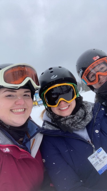 Dedicated Nursing Associate employees posing for a picture in their snow gear at Seven Springs Mountain Resort