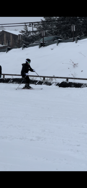 Dedicated Nursing Associate Employee skiing down the mountain