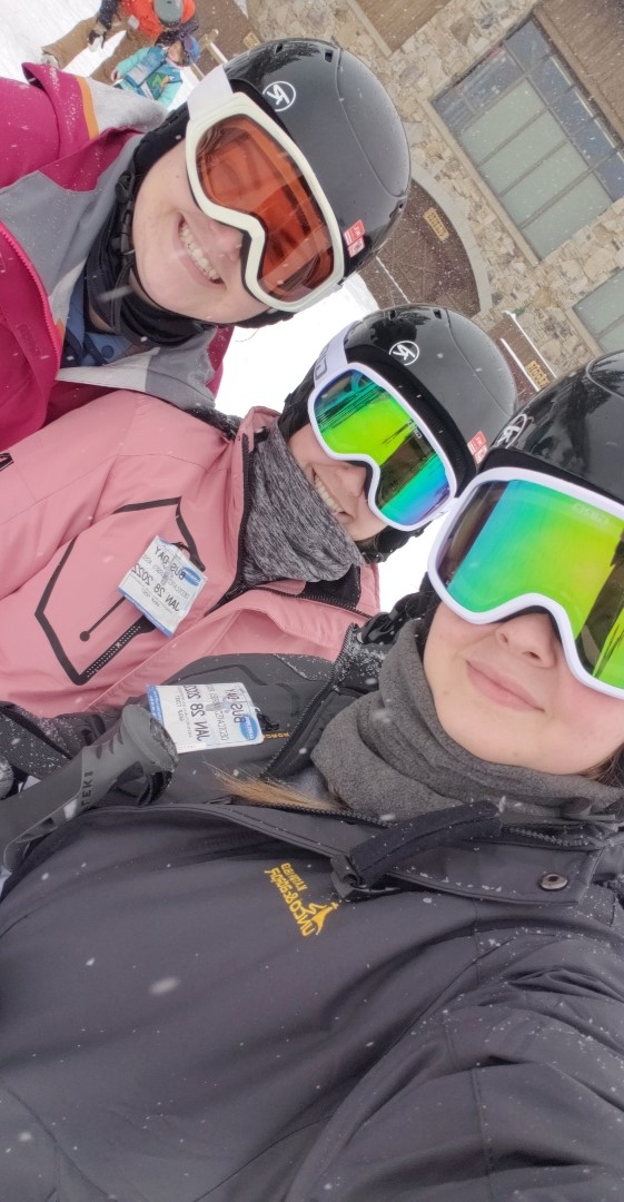 DNA employees posing for a picture wearing snow gear and snow goggles