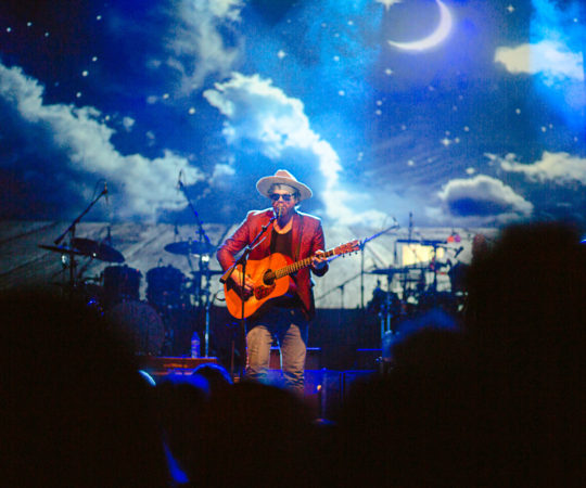 Michael Glabicki performing with his guitar along with Dirk Miller